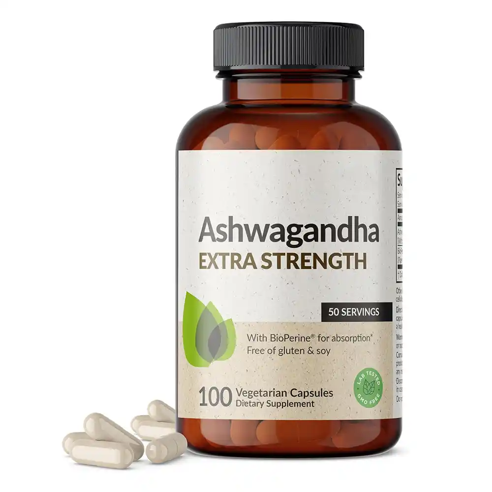 A slice of keto vanilla cake served on a white plate with a fork.