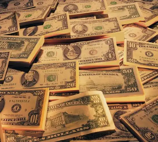 A slice of keto vanilla cake served on a white plate with a fork.