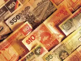 A slice of keto vanilla cake served on a white plate with a fork.